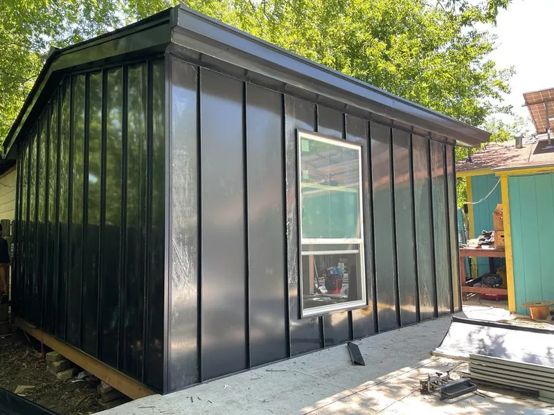 Black standing seam metal wall panels for Roof Inspection in Napoleon